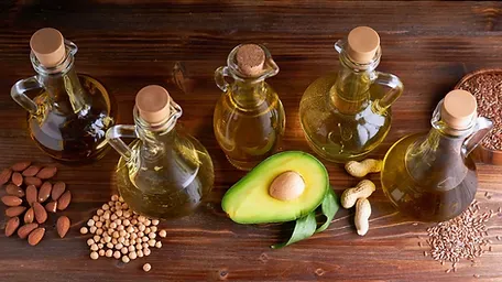 There are many different types of oils on the table.