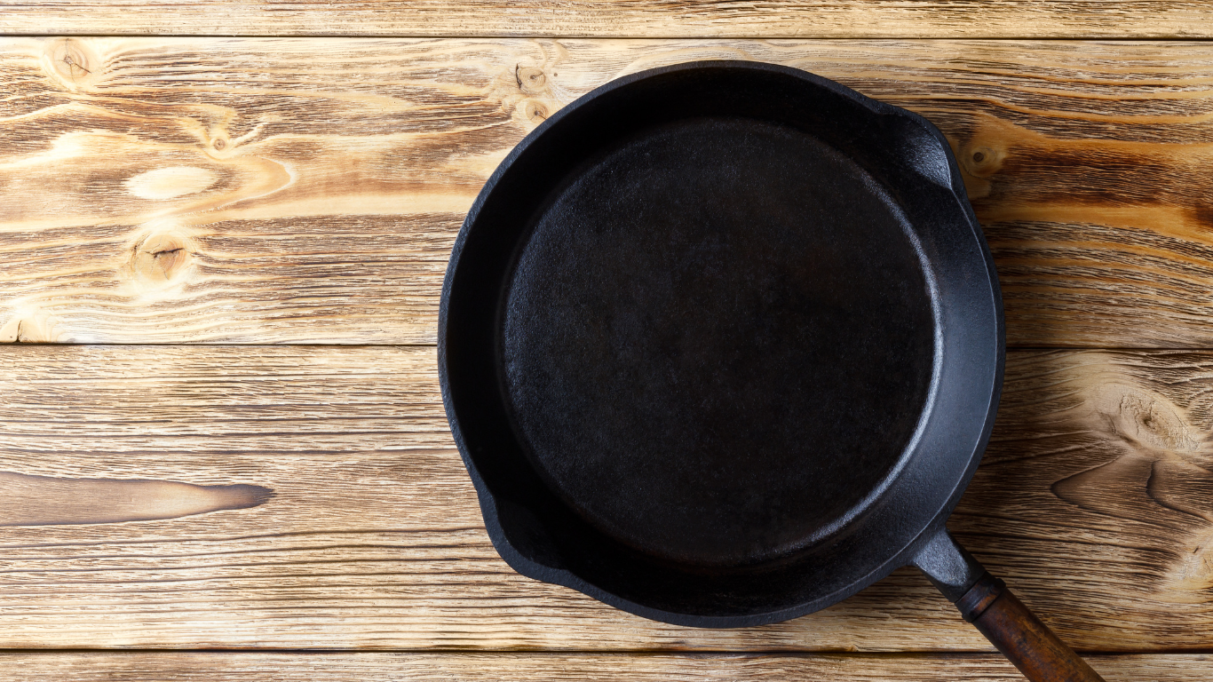A spread of whole-foods based proteins including beans, and nuts are laid out with a dark background.