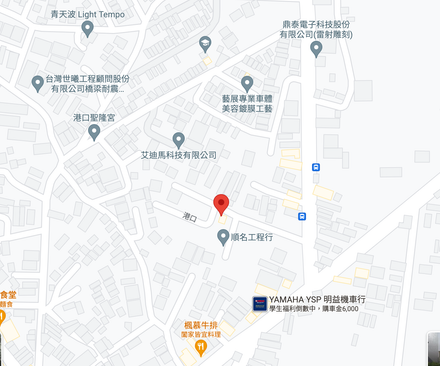 A map of a city with a red pin pointing the location of a building.