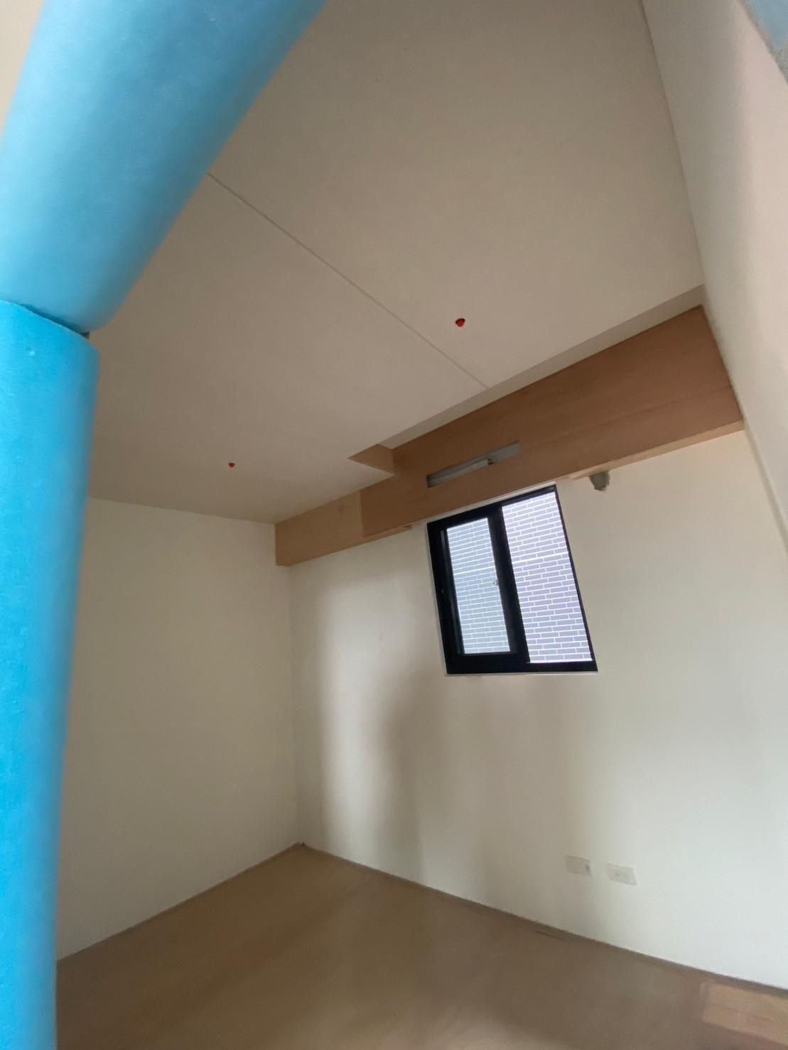There is a window in the middle of the room.
