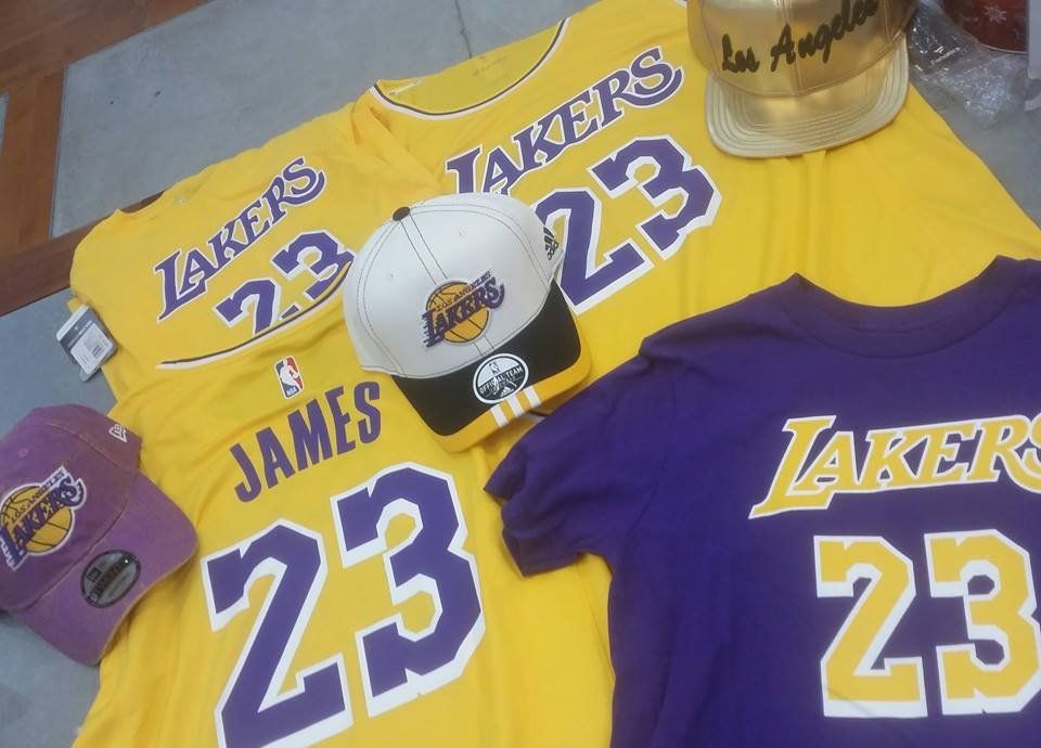 Los Angeles Lakers merchandise including two yellow jerseys, a purple shirt, and two caps with LeBron James number 23.