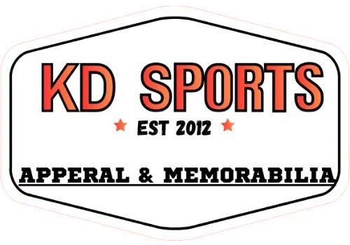 Logo for "KD SPORTS EST 2012" with the text "APPERAL & MEMORABILIA" in an orange-outlined white hexagon.