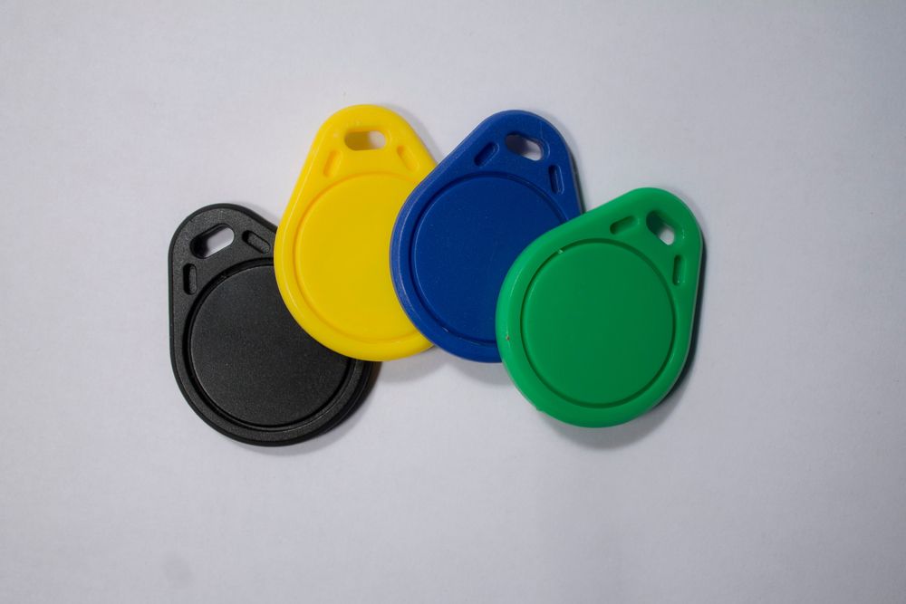 Four different colored plastic circles on a white surface