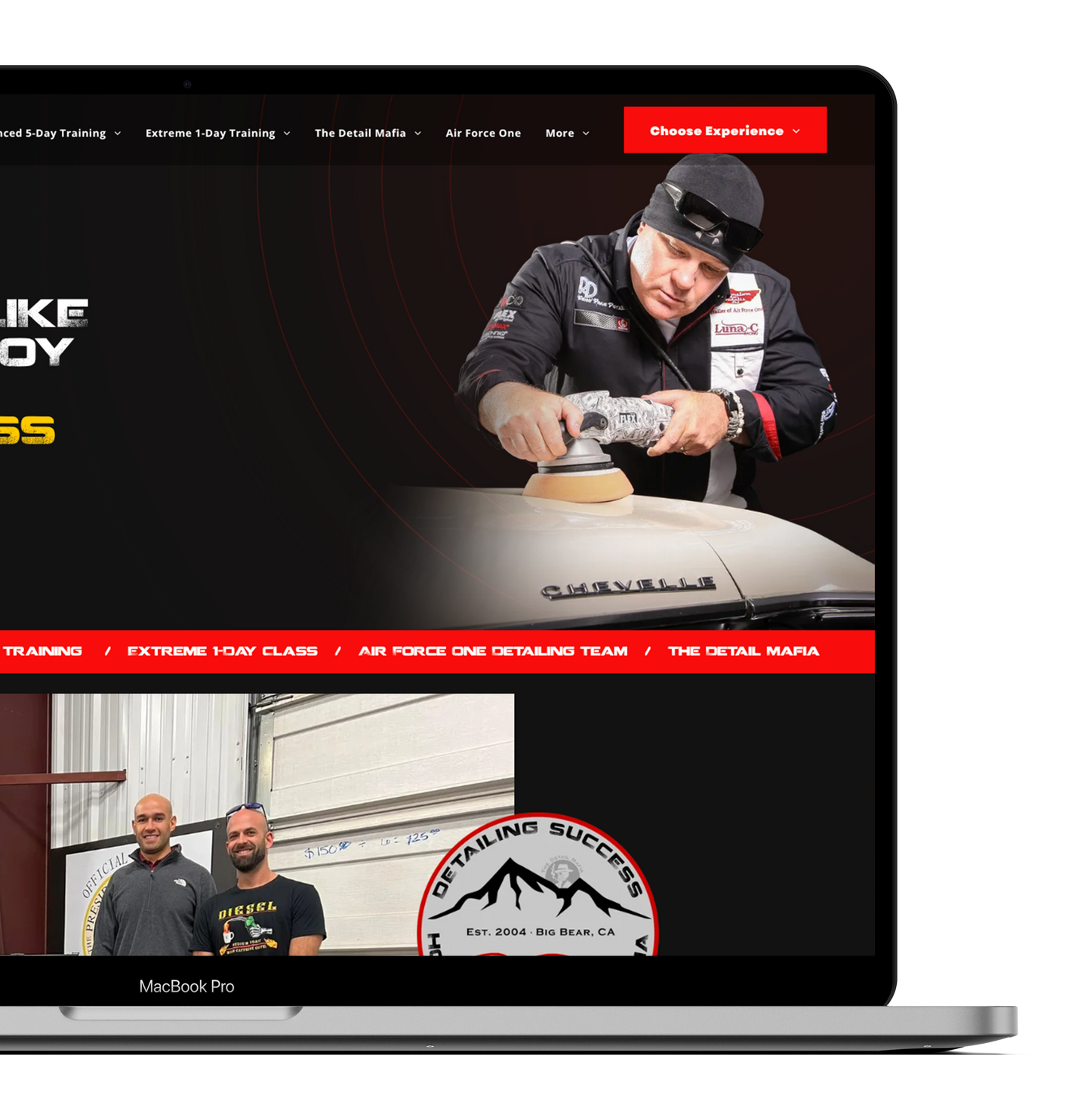 a laptop screen shows a man polishing a car .