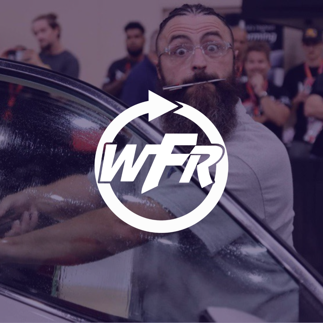A man in a car with a wfr logo