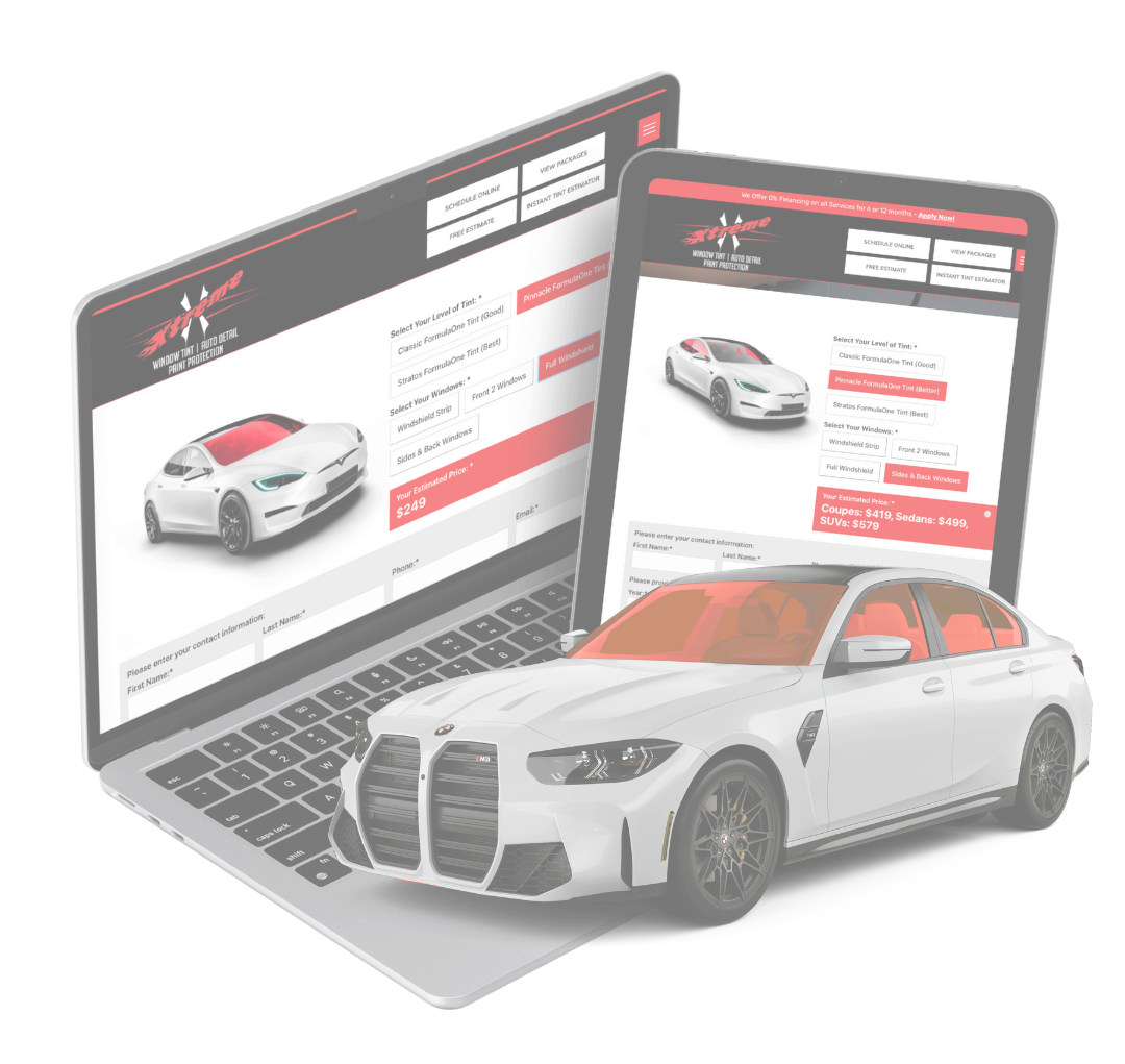 A white car is sitting on top of a laptop and tablet.