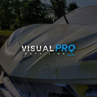 A close up of a car hood with the words visual pro detailing on it.