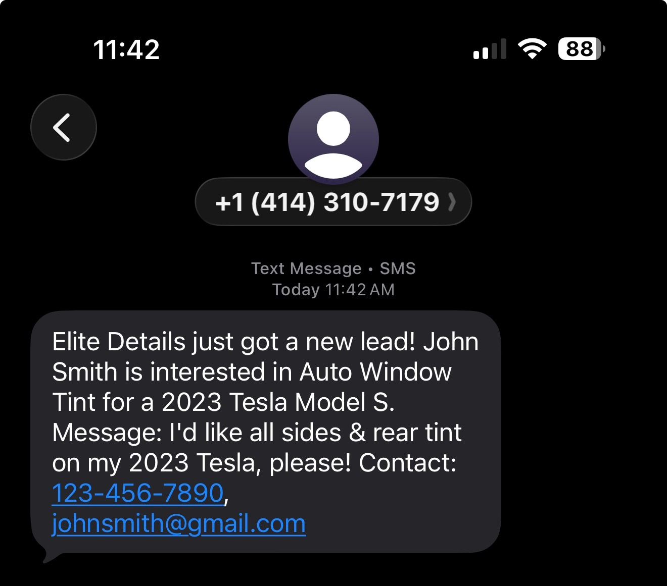 Phone screen showing a text inquiry for auto window tint on a 2023 Tesla Model S, with contact details.