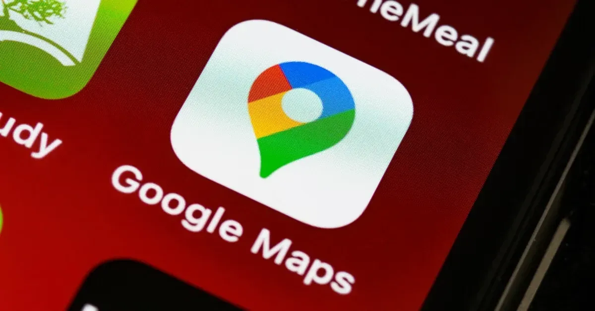 Google Maps app icon on smartphone screen with colorful pin logo for local SEO ROI tracking.