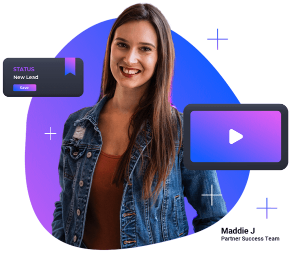 a woman in a denim jacket is standing in front of a video screen .