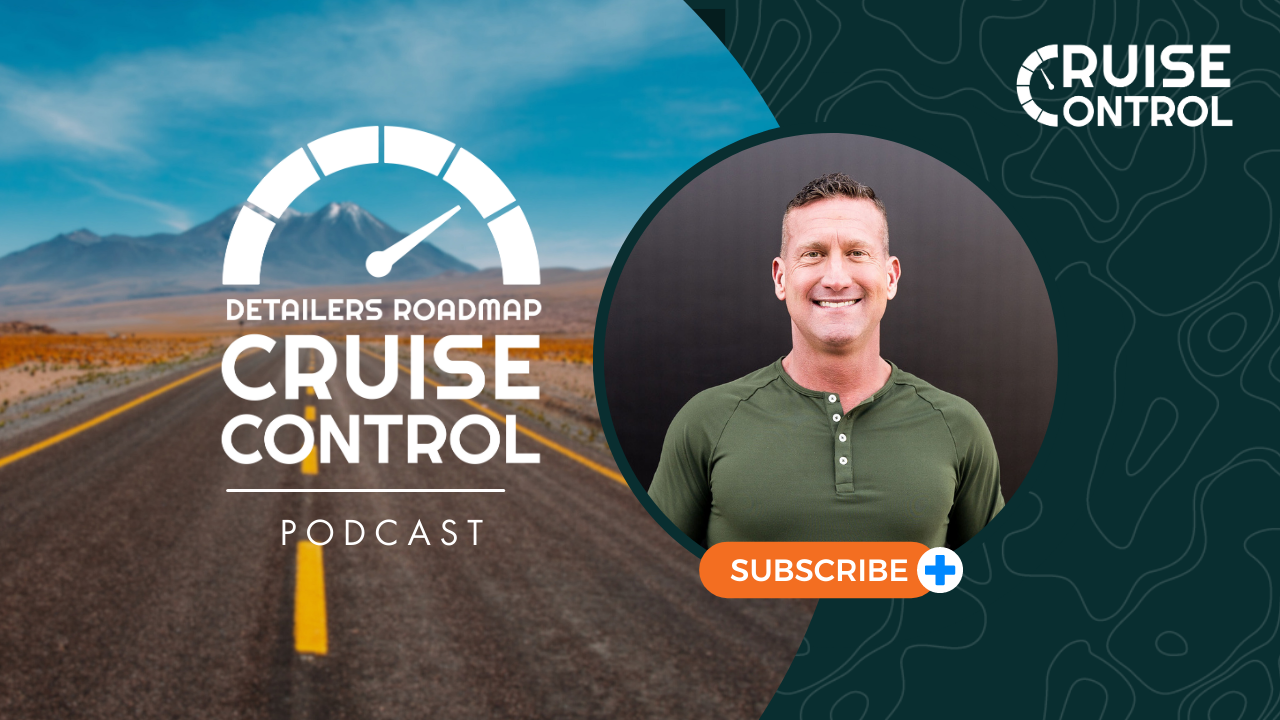 A man is smiling in front of a sign that says cruise control