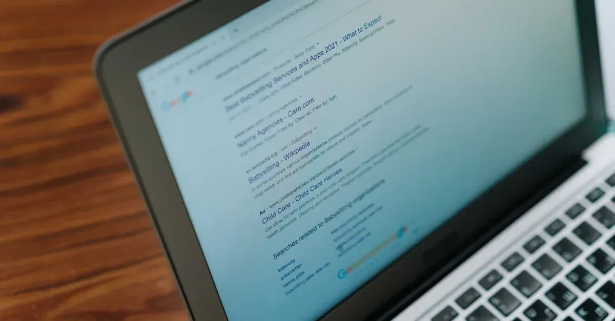 Laptop displaying search results and website code, demonstrating how automotive web design impacts Google rankings on.