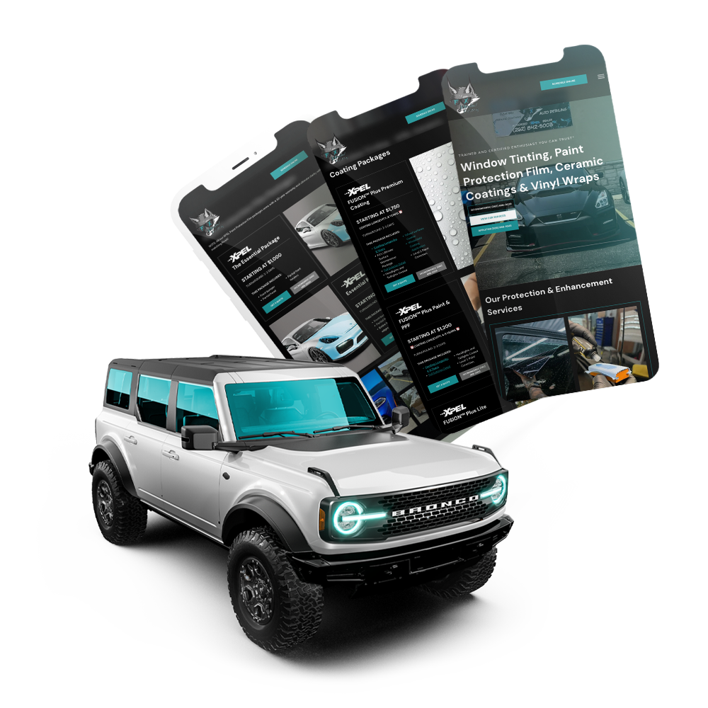 A white bronco is sitting next to a phone and FX Tint's window tinting website