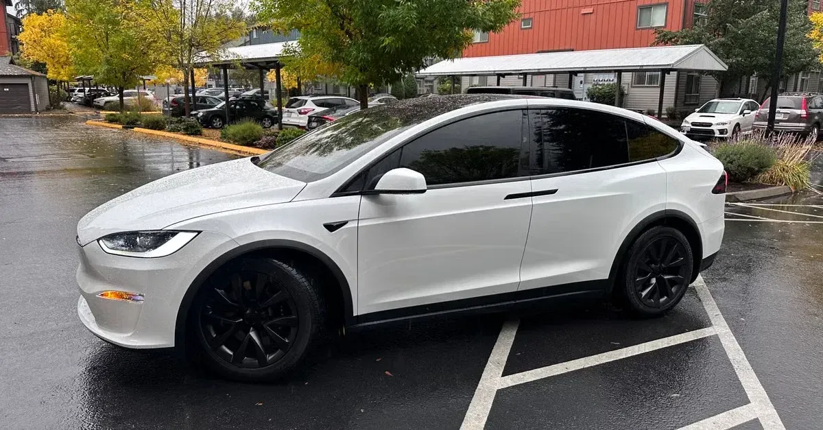 White electric SUV parked in lot showcasing automotive SEO services for detail and coating businesses.
