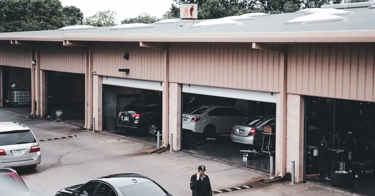 Professional auto detailing shop with multiple garage bays showcasing successful detailing marketing agency results.