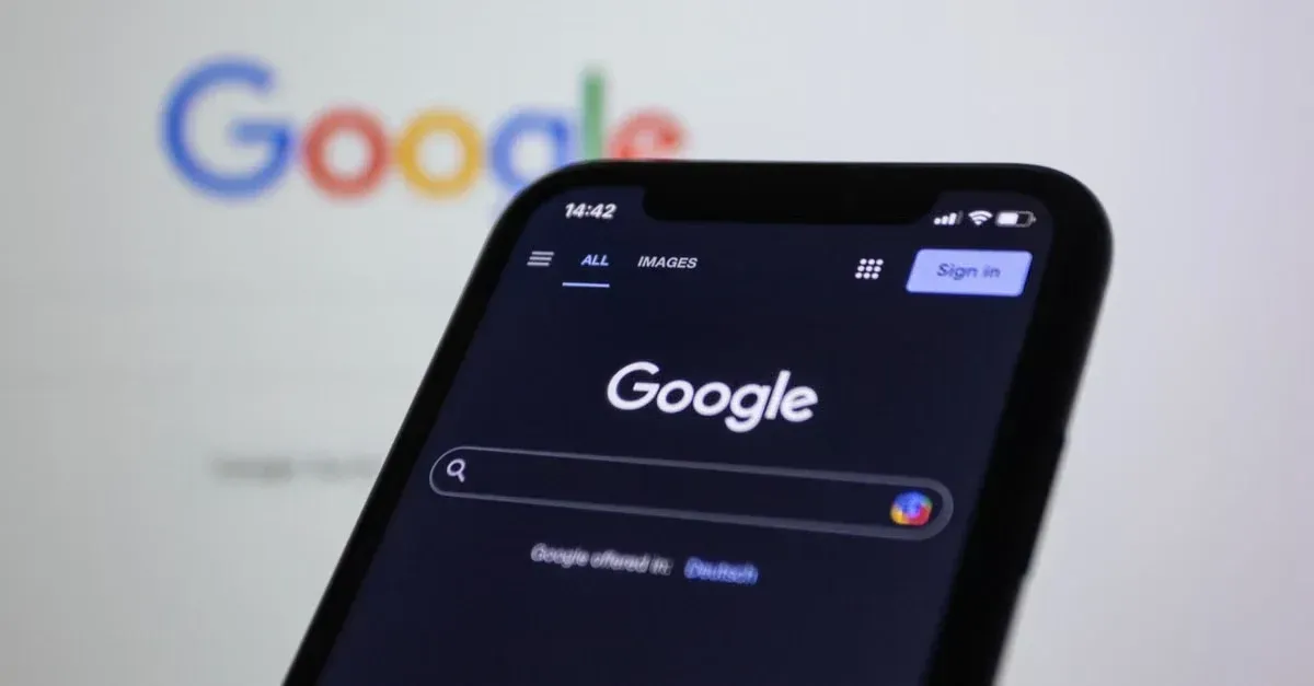 Smartphone displaying Google search interface with dark mode, representing PPF marketing challenges for auto shops.