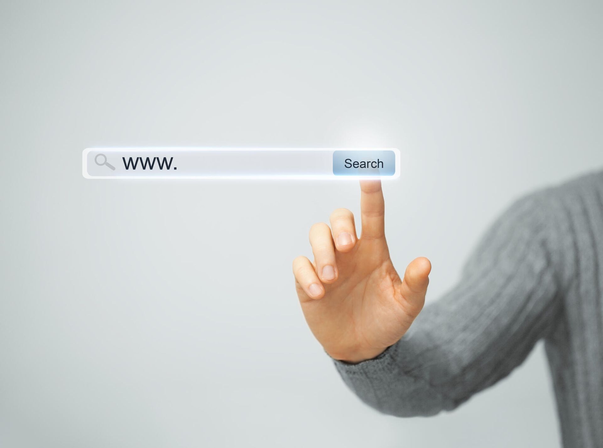 Person's hand pointing to a virtual search bar with