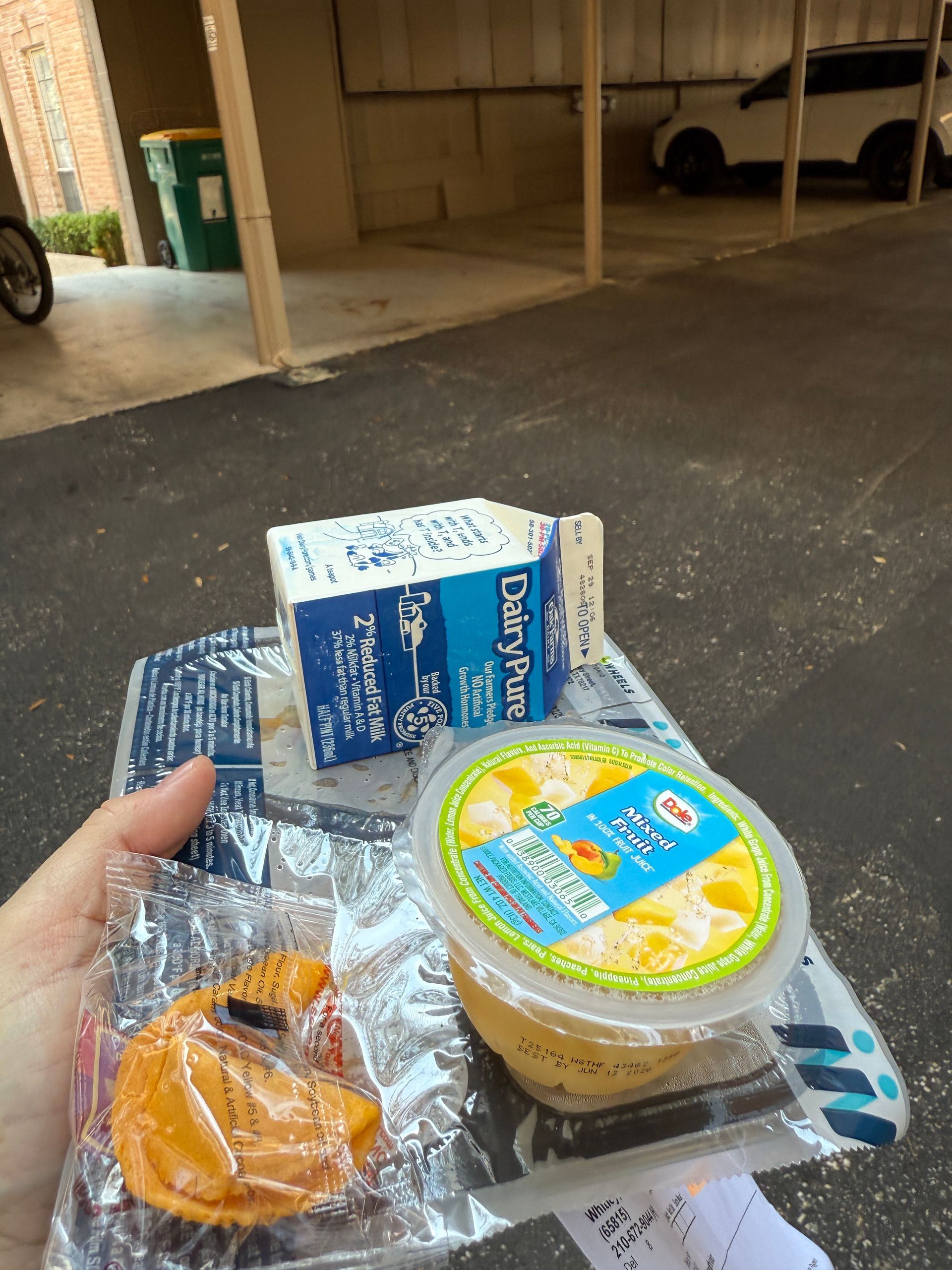 a man holding a meal to give to a senior citizen