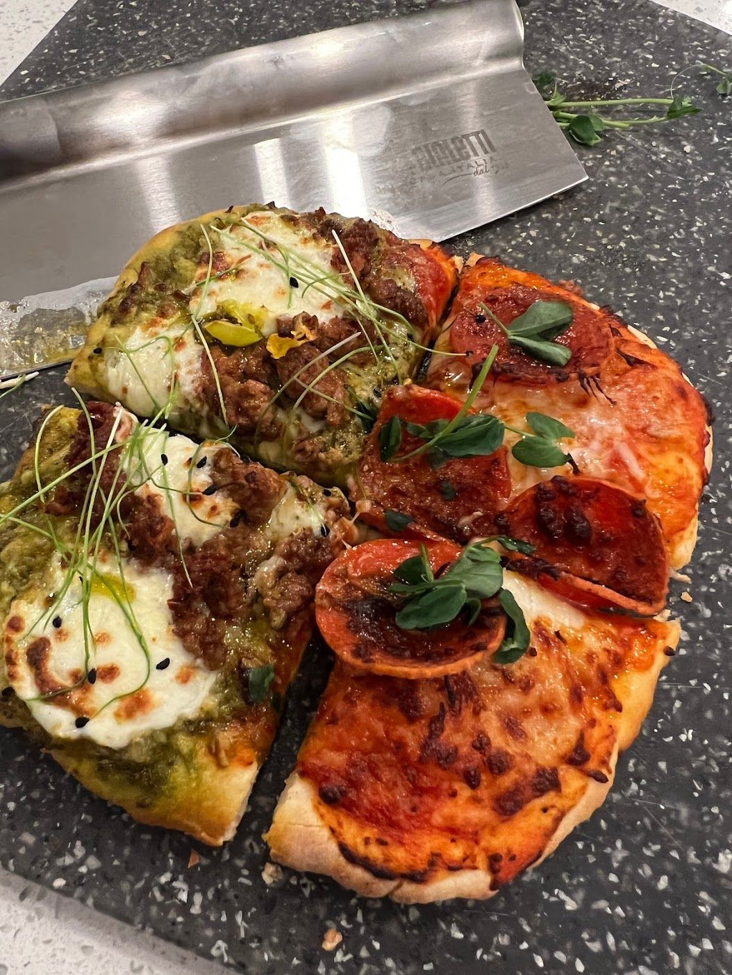A homemade pizza on a cutting board.