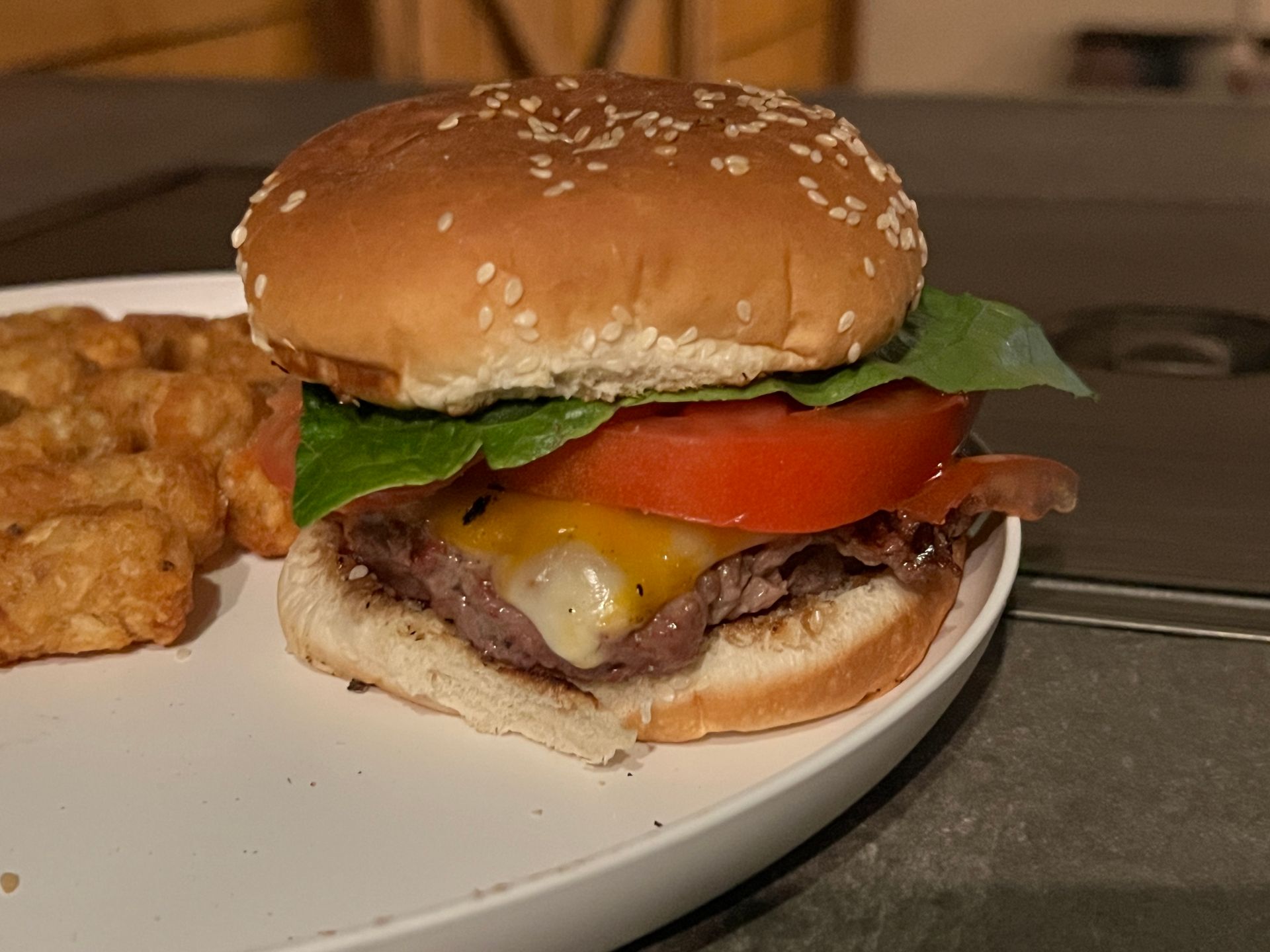 A white plate topped with a hamburger and french fries