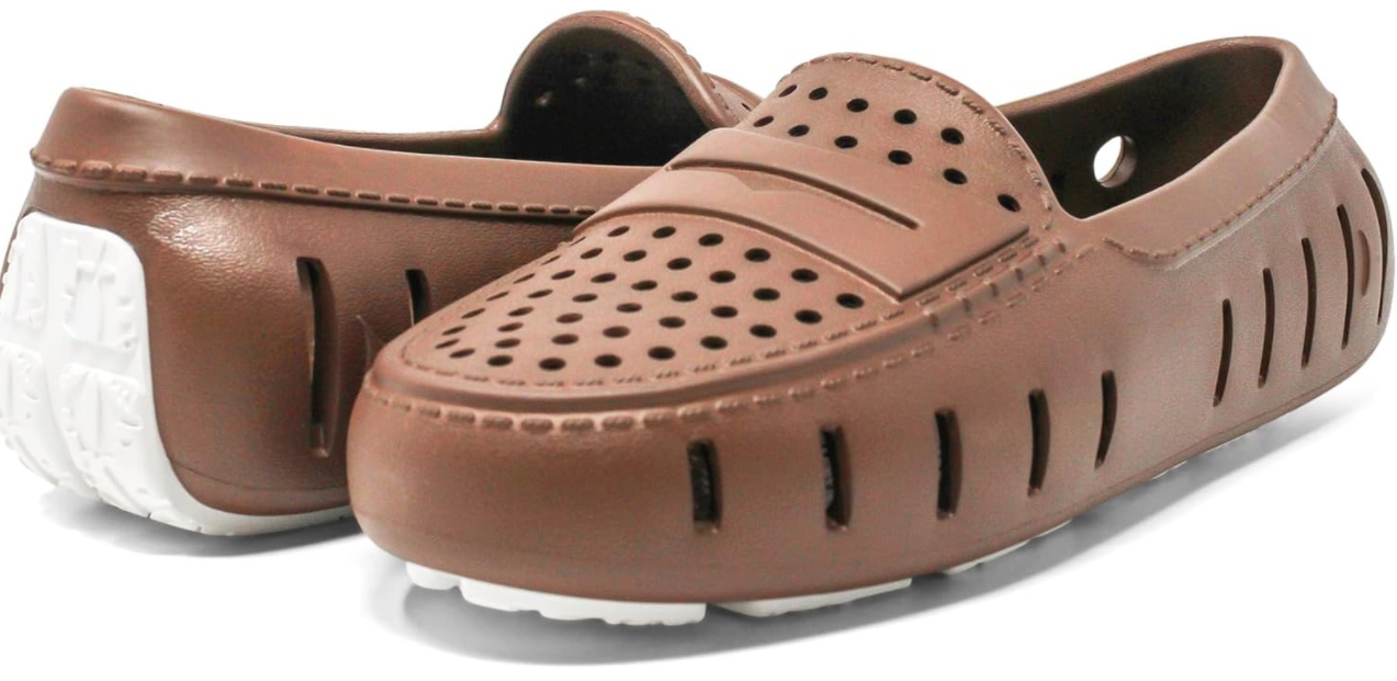 A pair of brown loafers with white soles on a white background.
