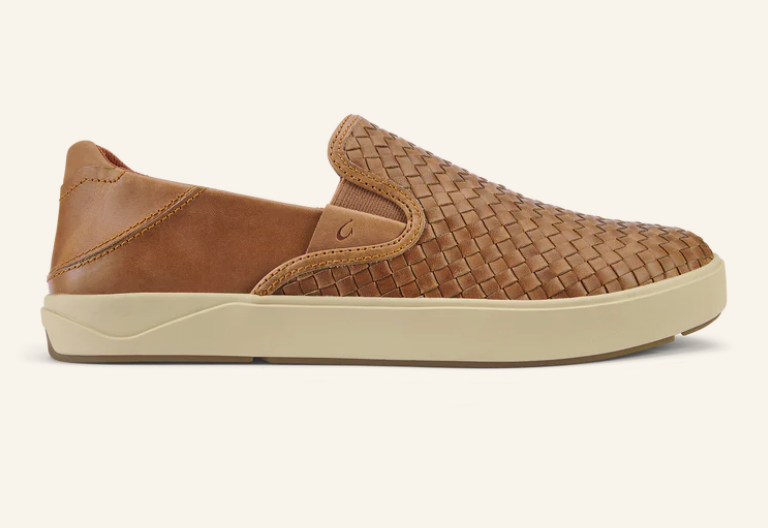 A pair of brown shoes with a white sole on a white background.