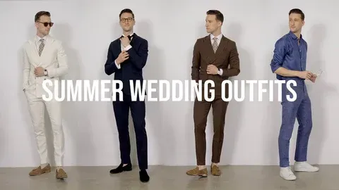 Four men in suits are standing next to each other in front of a white wall.