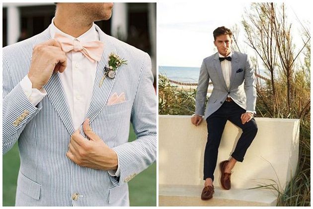 A man in a suit and bow tie is sitting on a wall.