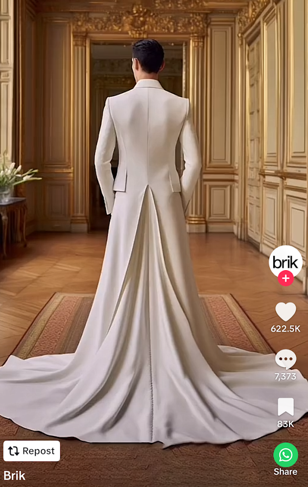 A man in a long white dress is standing in a room.