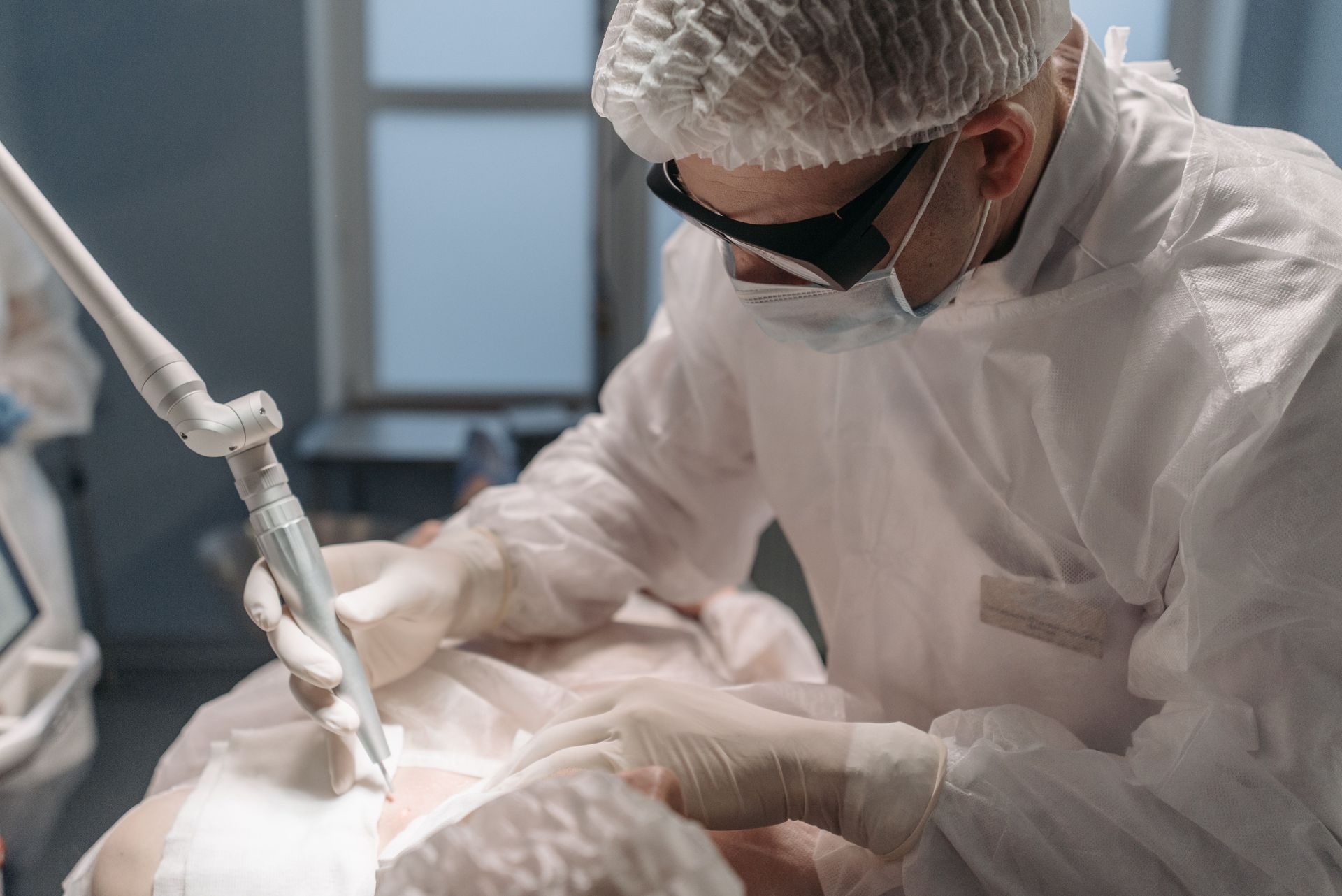 laser treatment in medical setting performed by doctor on patient