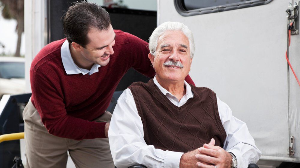 Smiling Old Man With Van Behind — Forsyth, NC — Safe Ride Transportation Smiling Old Man With Van Behind — Forsyth, NC — Safe Ride Transportation