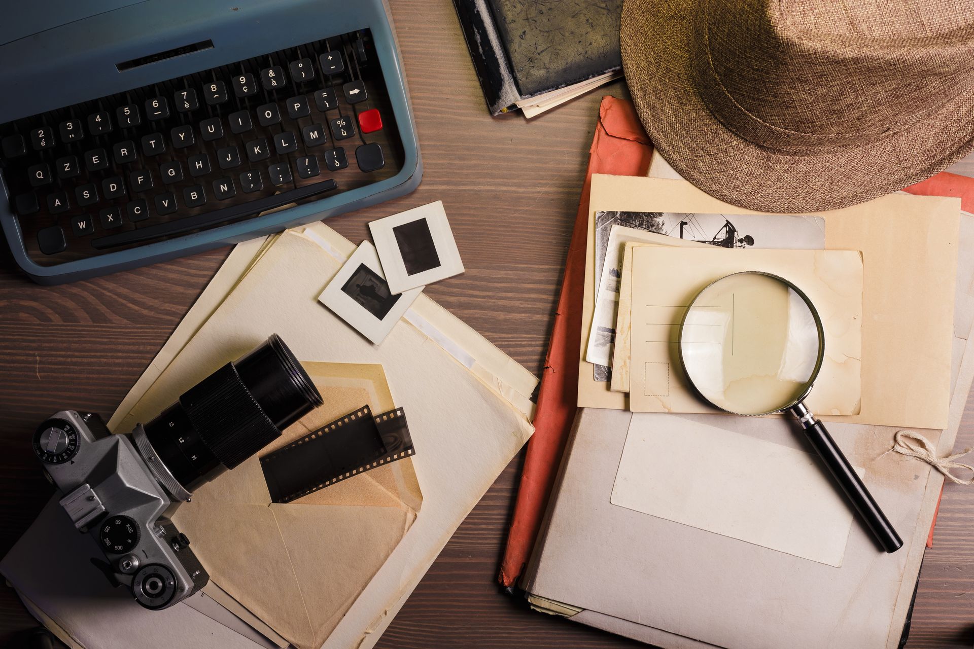Vintage investigator desk with camera and files, perfect for private detective services. Vintage investigator desk with camera and files, perfect for private detective services.