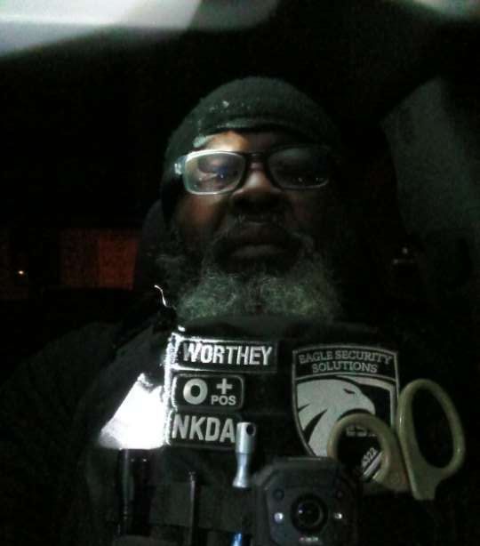 Man in security vest with