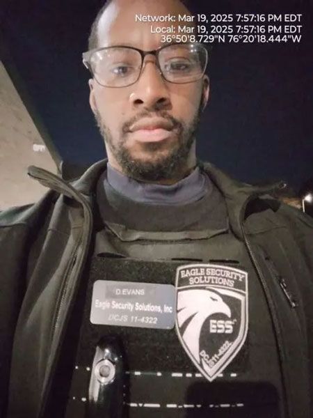 Man in glasses and security vest,