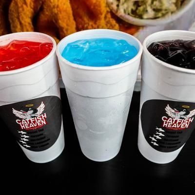 Three cups of catfish heaven drinks on a table