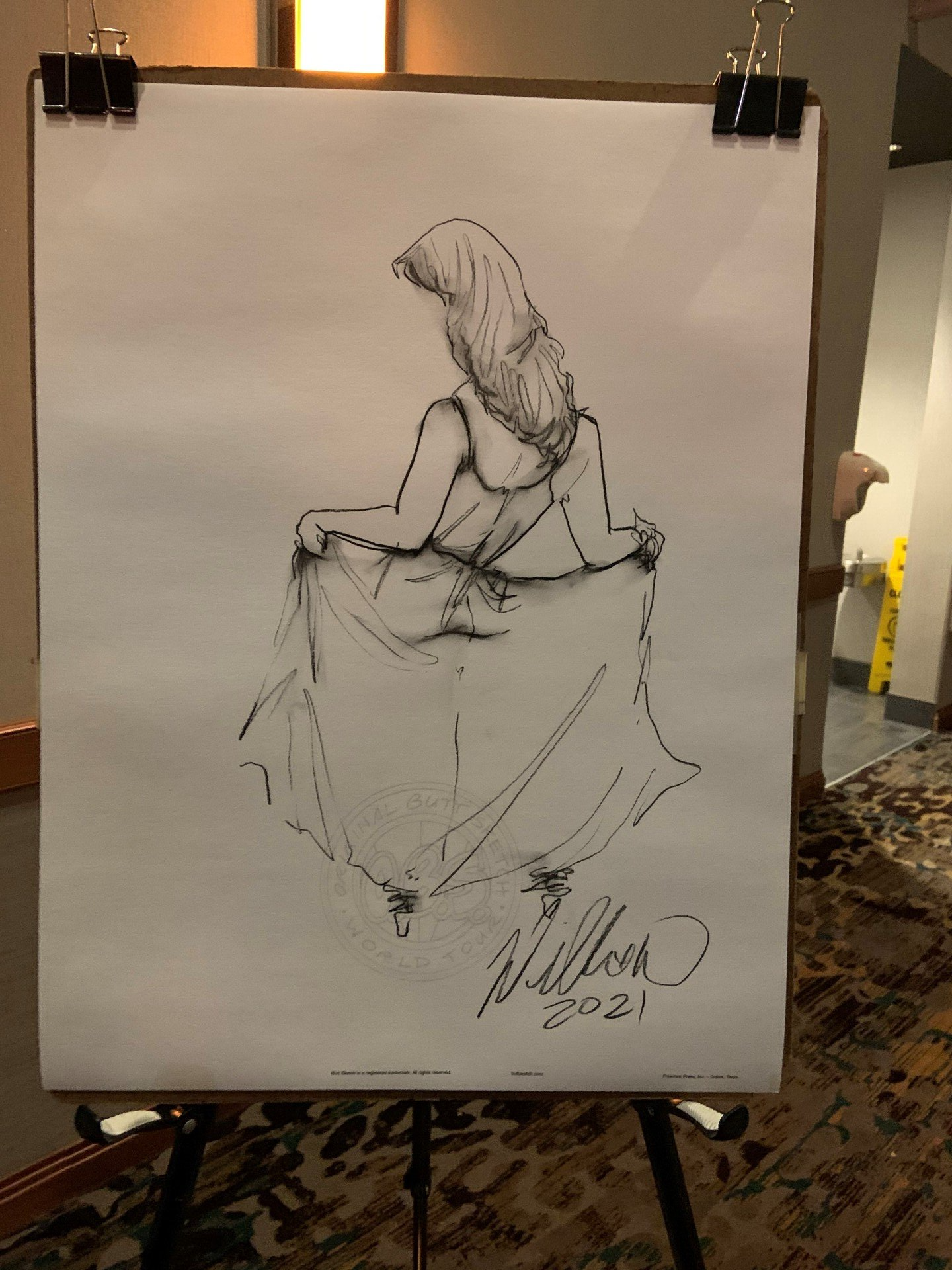 A black and white drawing of a woman on an easel