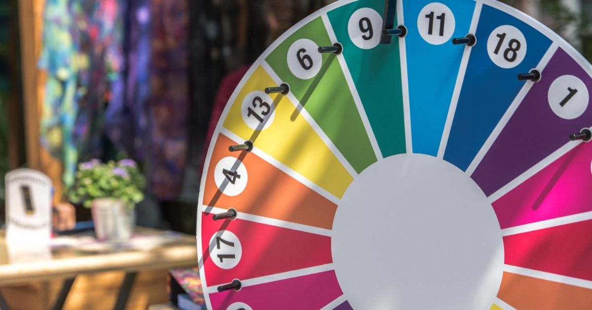 A numbered prize wheel with rainbow-colored sections.