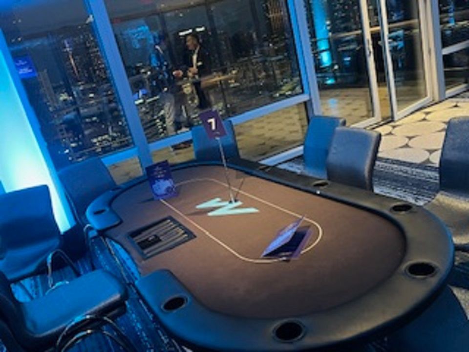 A poker table with a number 7 on it in a room.
