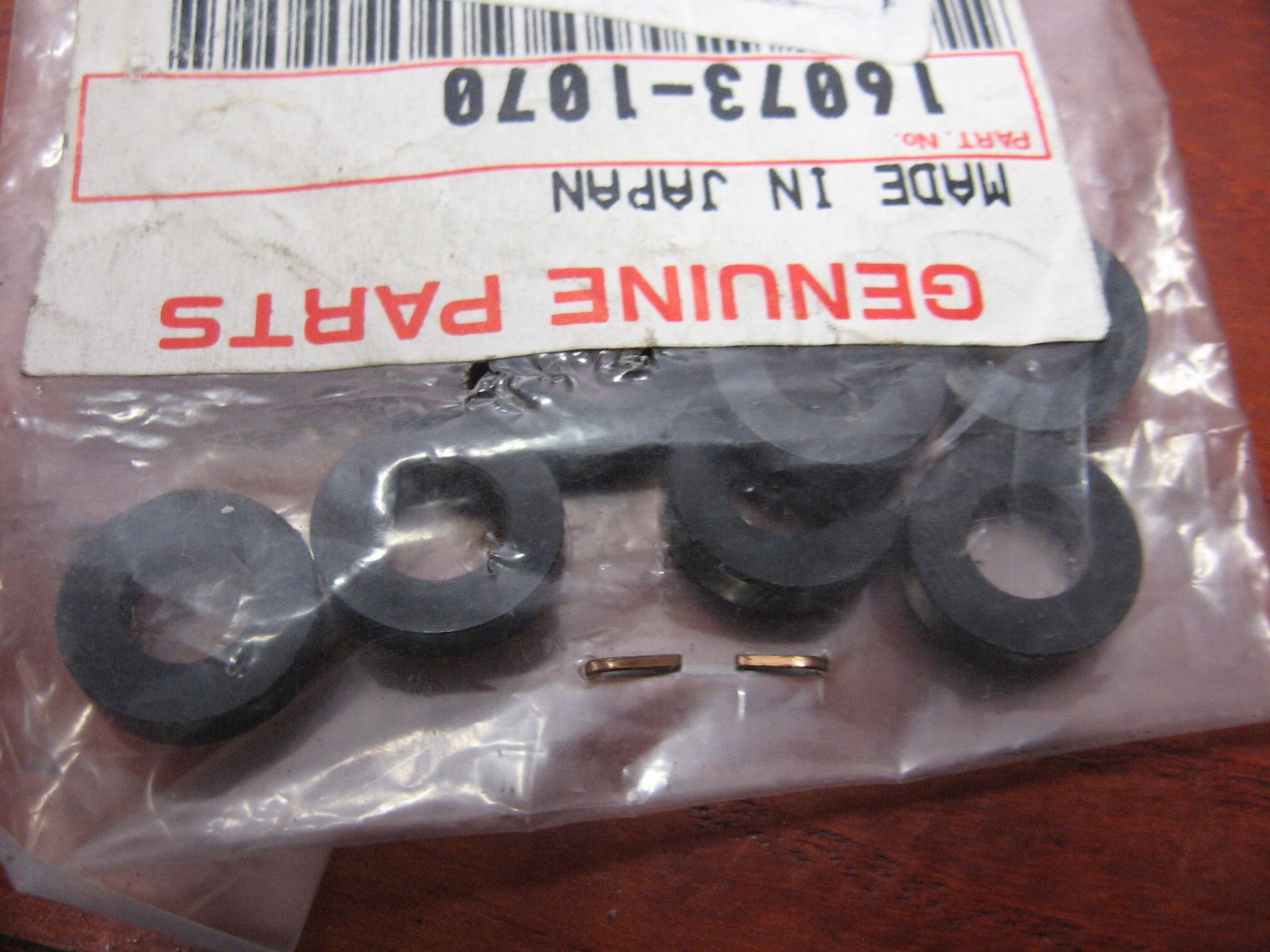 4x kunstof ring insolator , 6,5x12,5x2 – vn1500 87-99	bevestiging hitten schild	oem	16073-1070