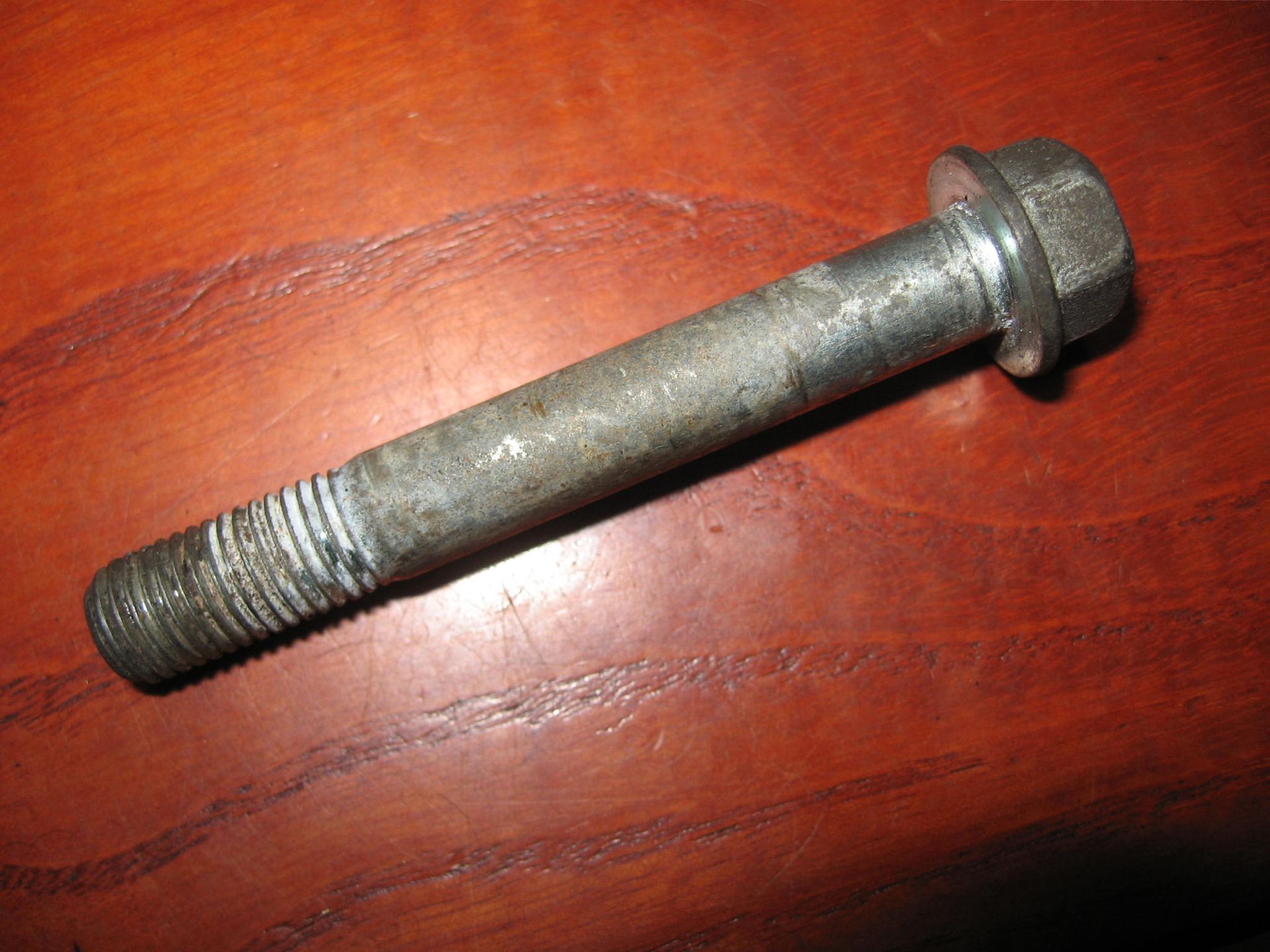 Flens bout blokbevestiging achter koppen M10x70		90125-mm2-000