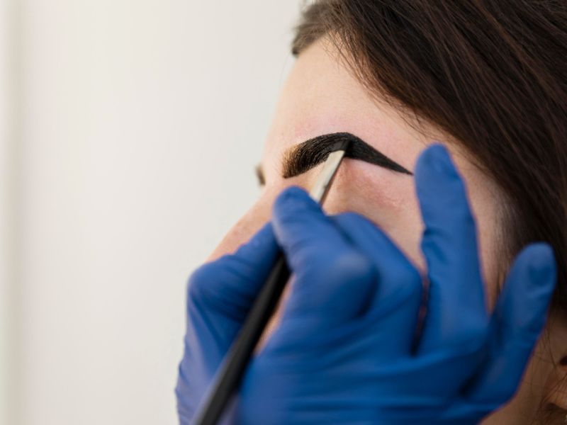 Woman getting tinted eyebrows