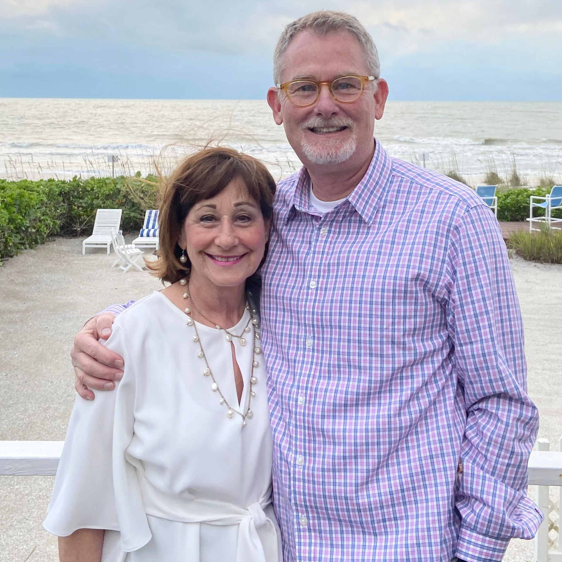 Owners of Crafted 1111 standing outside in Florida on the beach