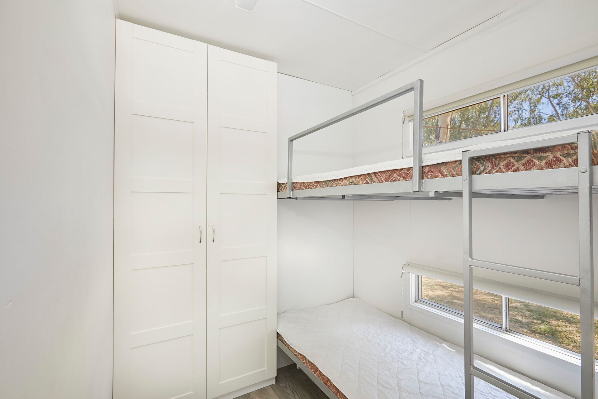 Apex Riverbeach Holiday Park cabin's bunk beds , wardrobe