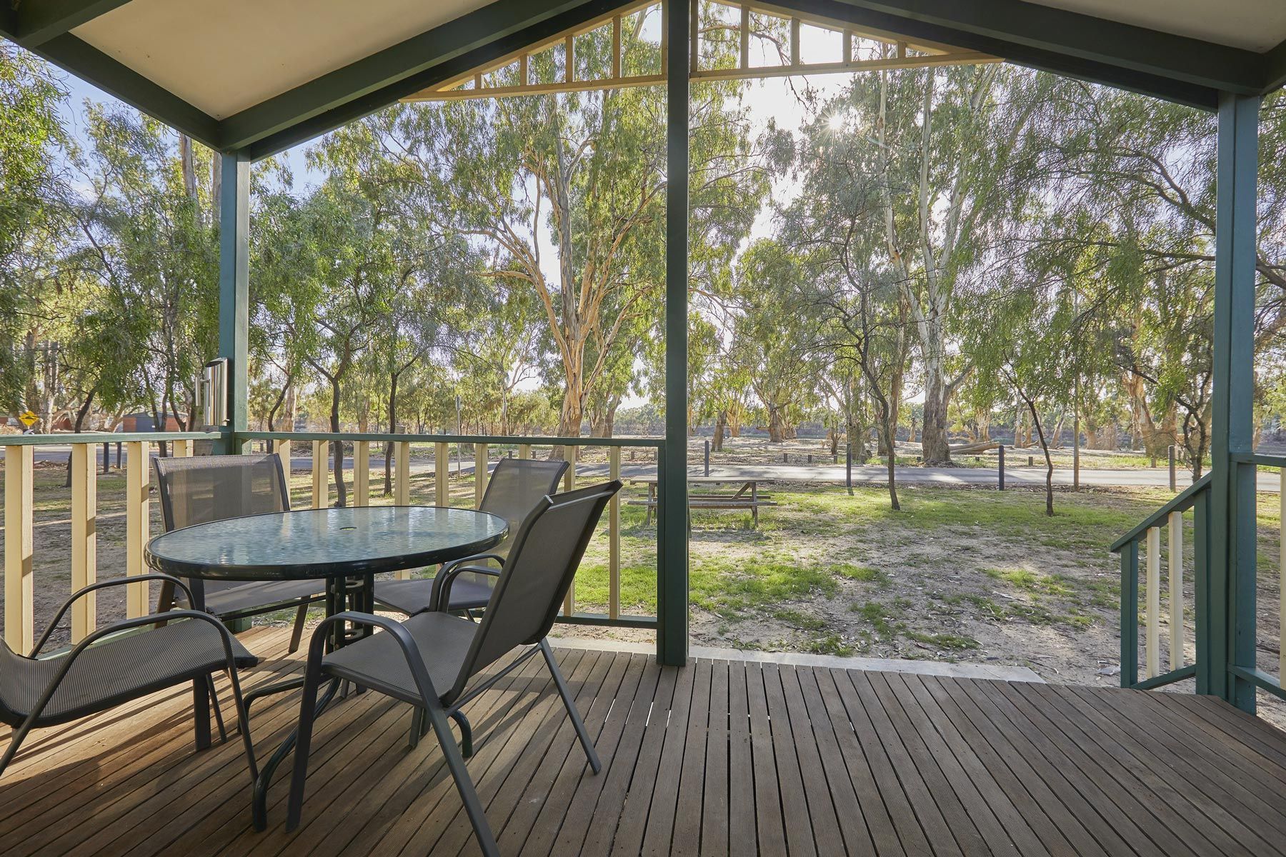 Apex Riverbeach Holiday Park Cabin alfresco outdoor dining wooden deck with table and chairs