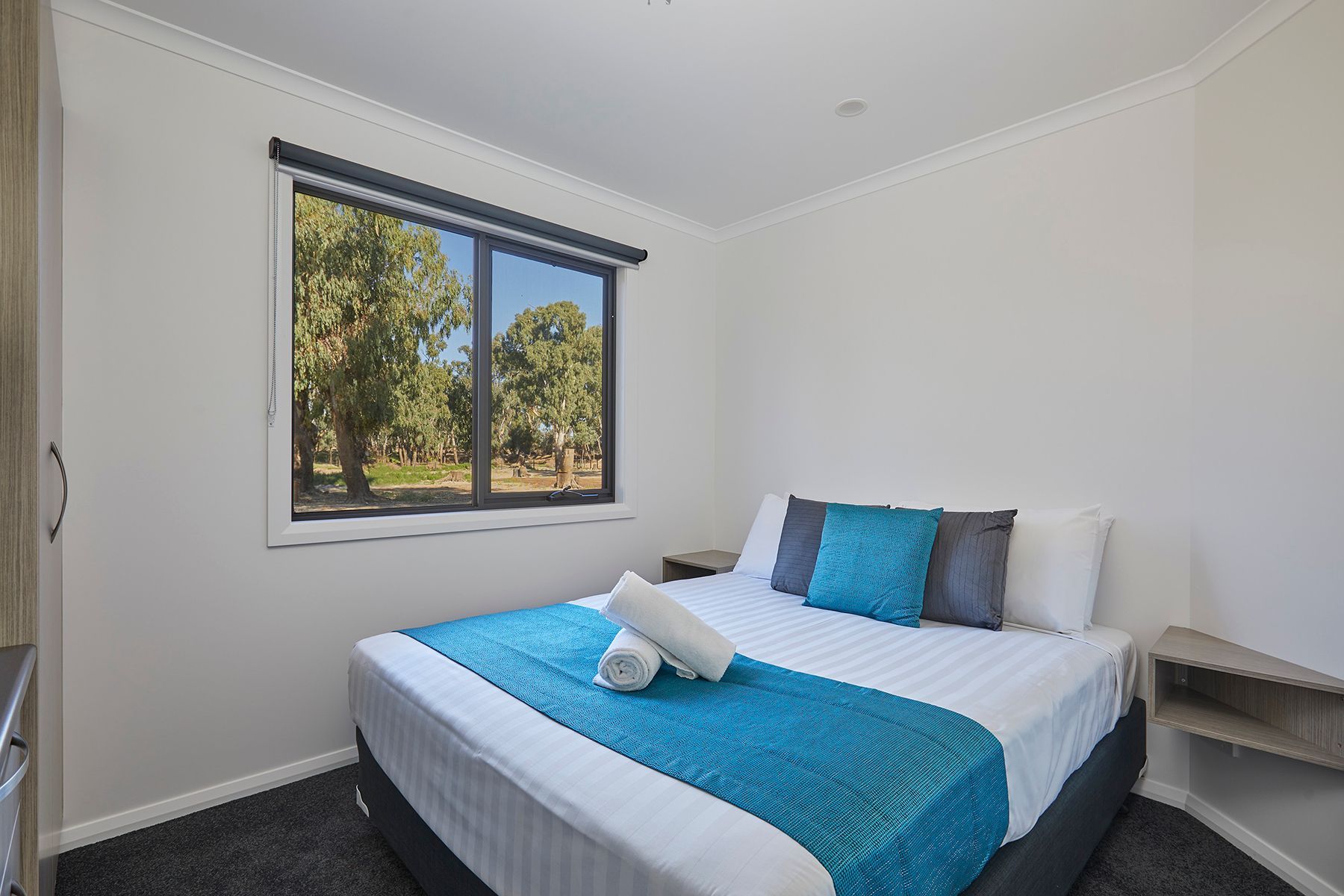 Apex Riverbeach Holiday Park cabin with bed