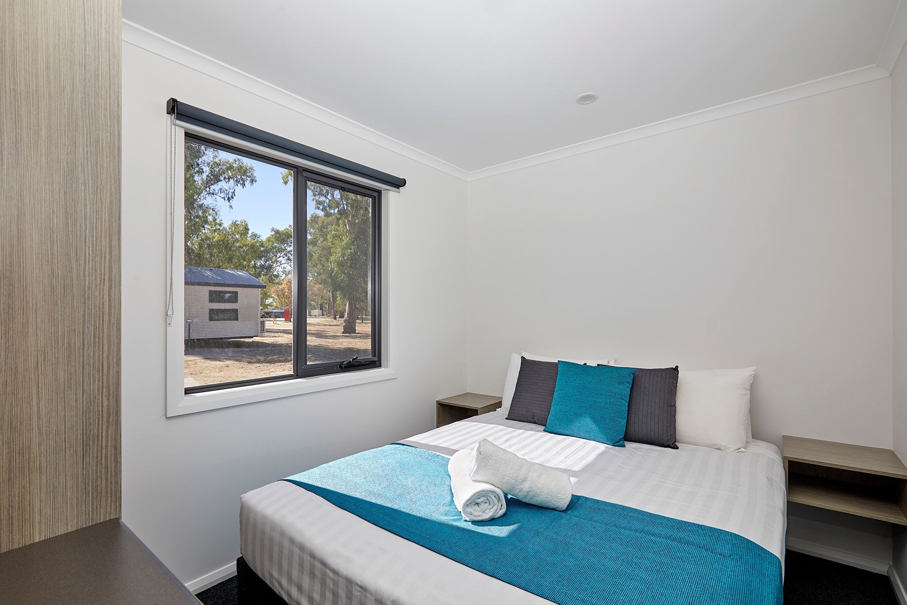 Apex Riverbeach Holiday Park cabin with bed