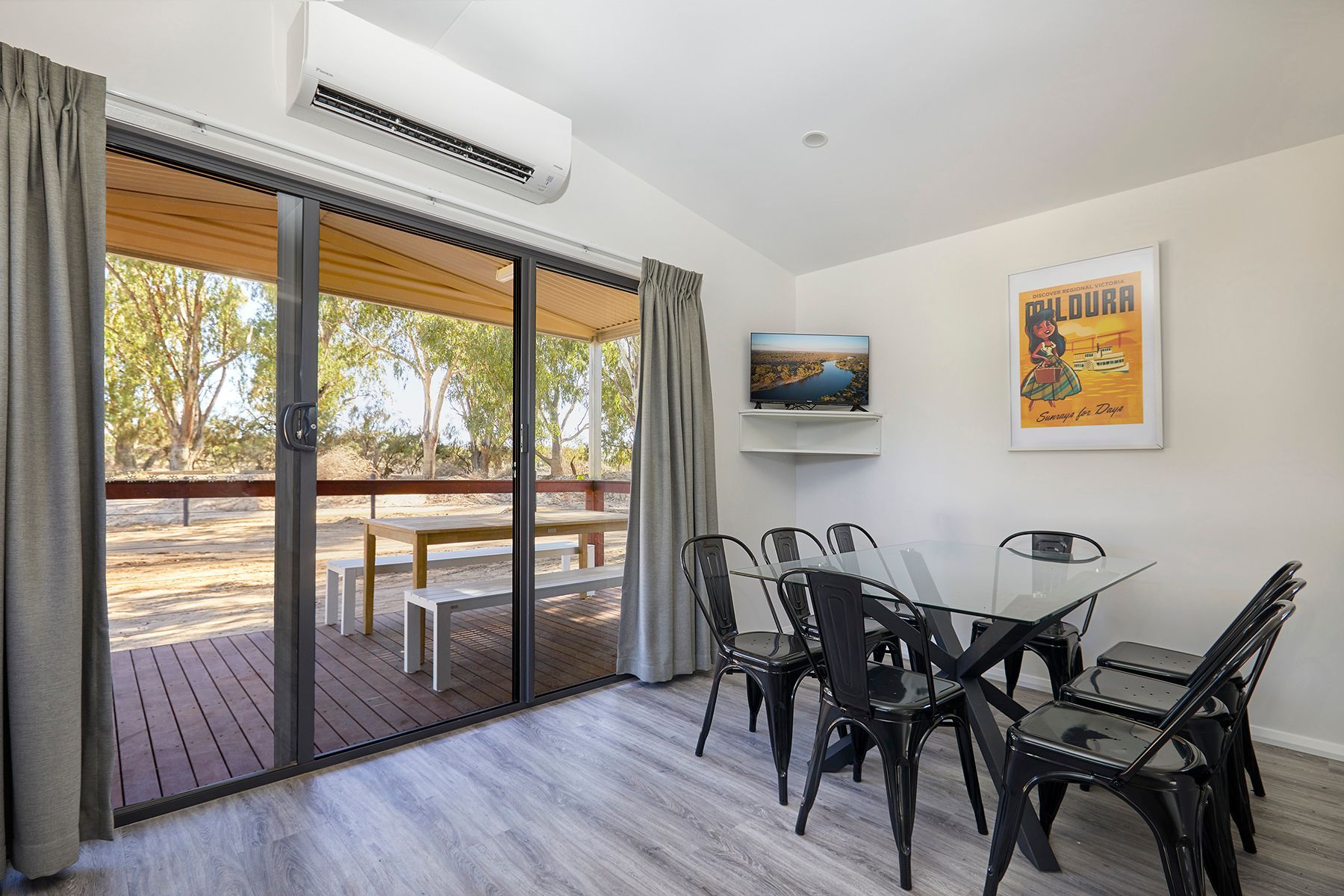 Apex Riverbeach Holiday Park cabin , table and chairs , lounge room