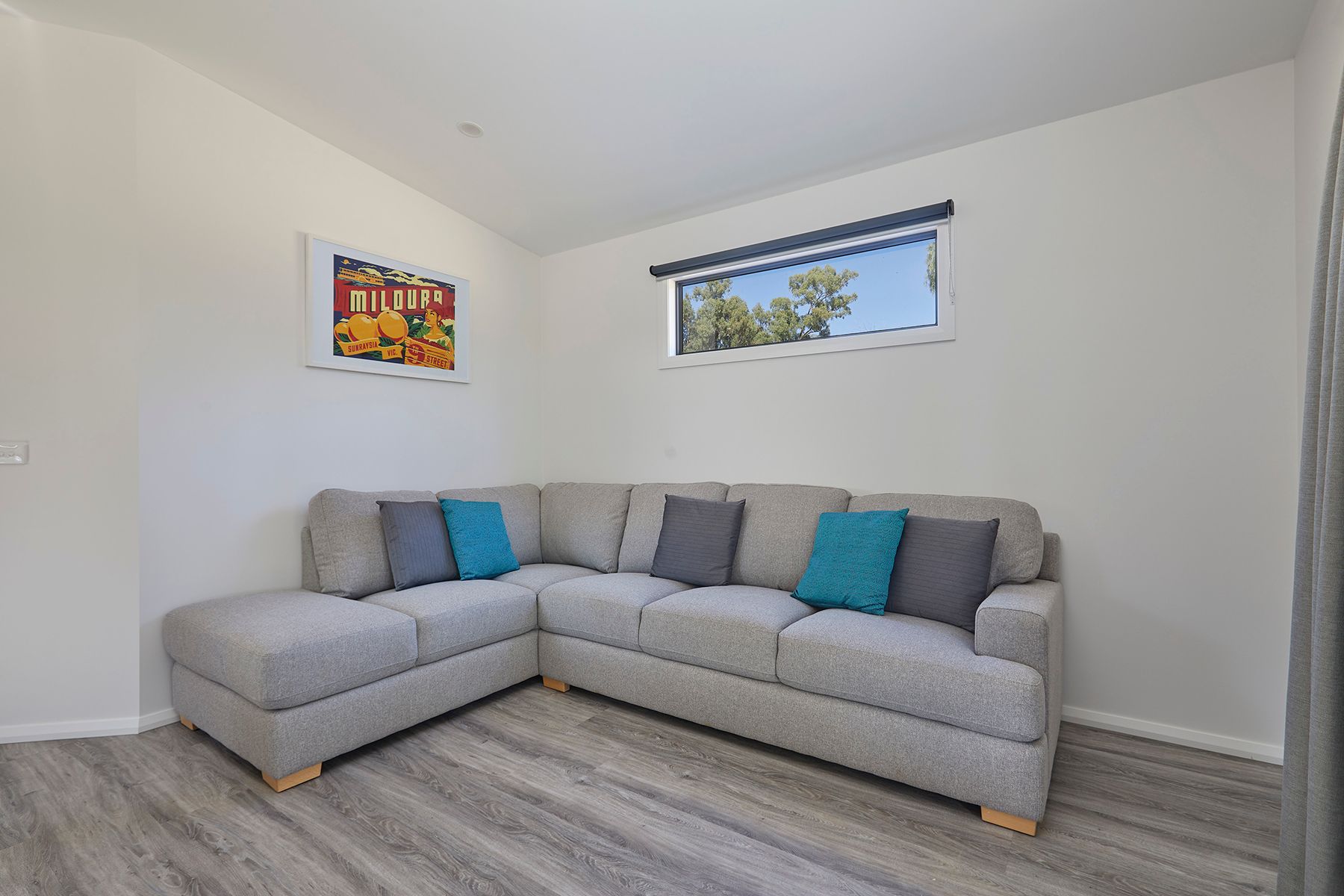 a floor plan of Apex Riverbeach Holiday Park cabin with couch