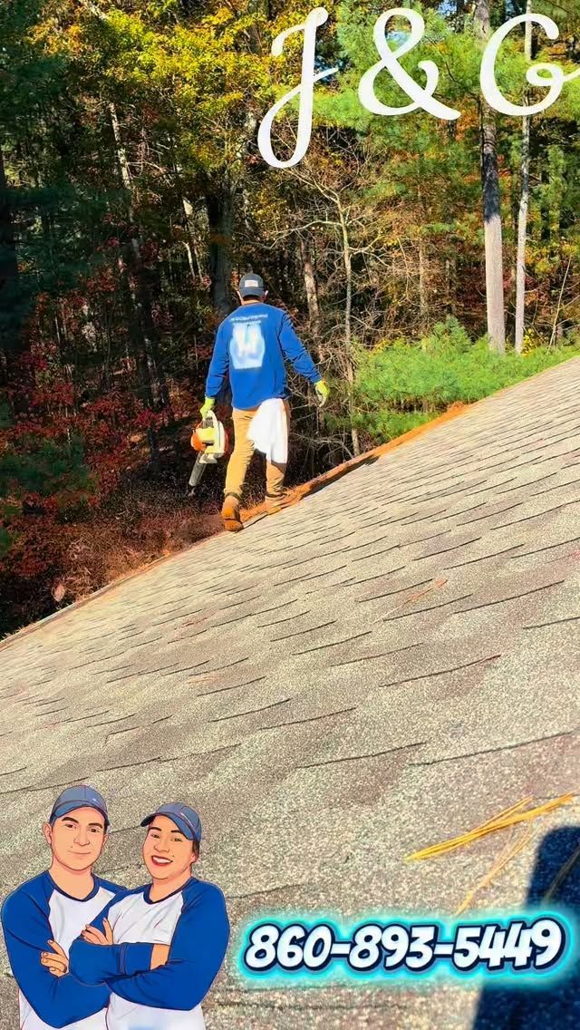 Two workers on a sloped roof, with “J&G” and phone number 860-893-5449 over a wooded background.