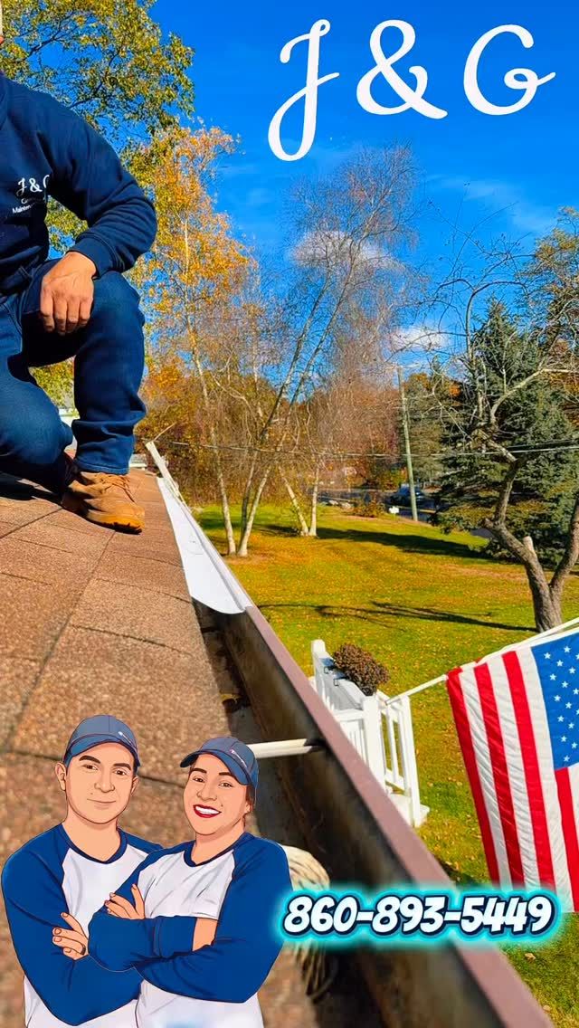 Roofing workers on a house roof in fall, with “J&G” and phone number 860-895-5409.